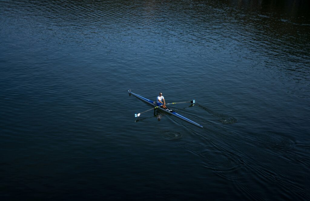 rowing on a calm body of water